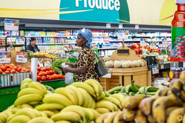 Locals grab produce in Baltimore Highlands at LA Mart.