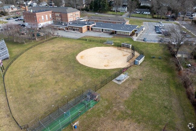 Harrison Avenue Elementary School has a baseball field for the athletes.