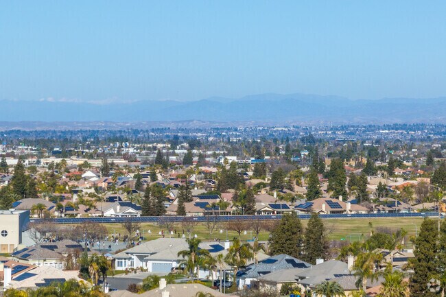 A hazy skyline looms over Bakersfield as poor air quality impacts visibility and health.