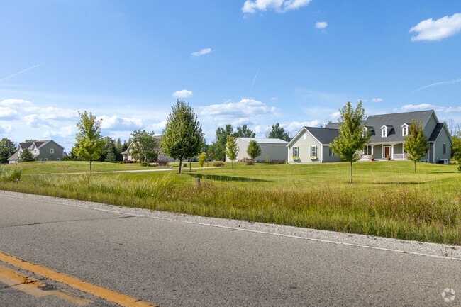 Raymond’s streetscape features homes on large, tree-lined parcels.
