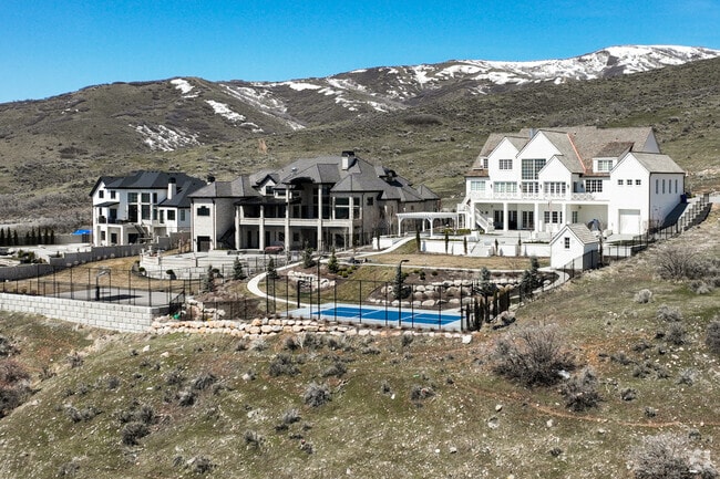 Large Alpine homes often include spacious backyards and courts.