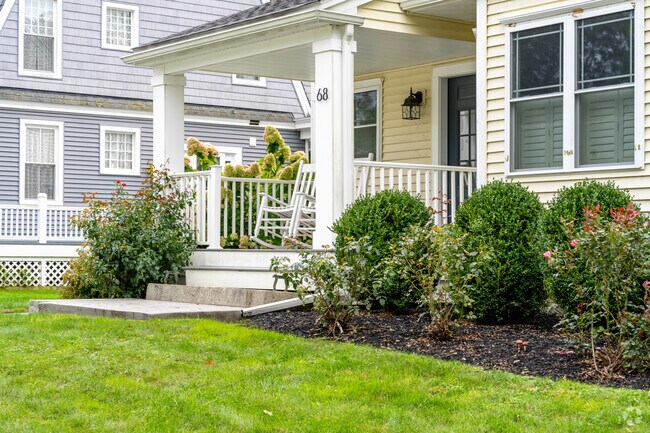 Home with a small farmers porch and well maintained yard on Dutcher Street in Hopedale.