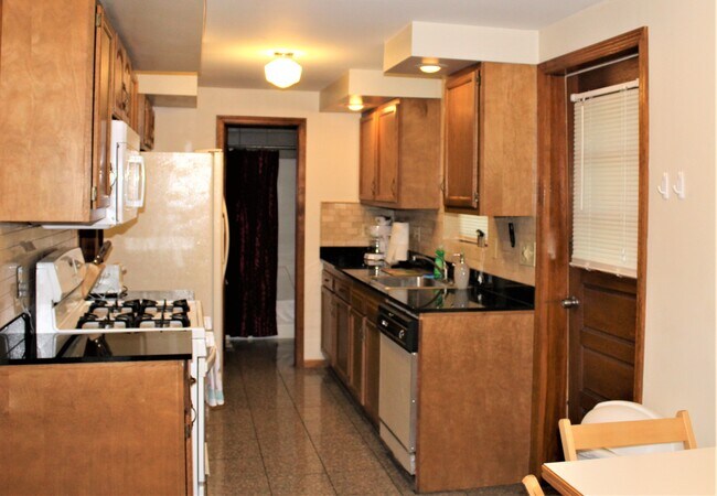 Gas range, microwave and refrigerator with ice maker