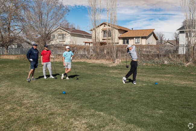 Three brothers golf with their dad at Eagle Lake Golf Course in Roy.