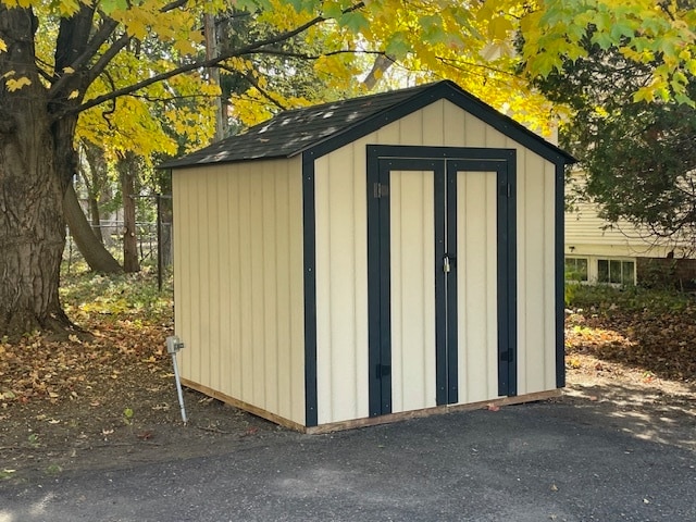 Storage shed on by parking pad