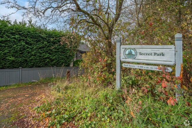 Secret Park is a shady playground space in a wooded area.