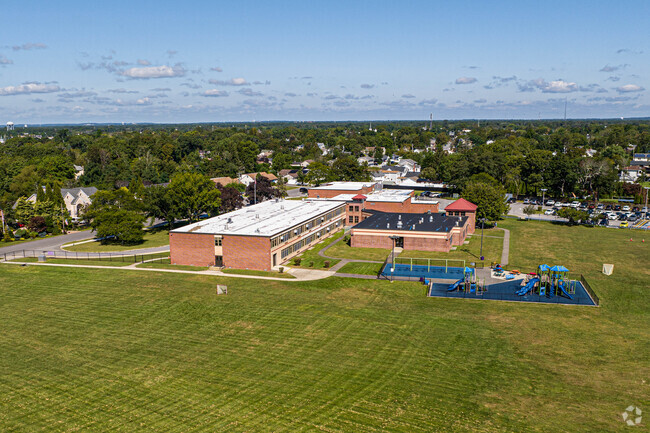 This is the rear aerial of the school showing the field and playground.