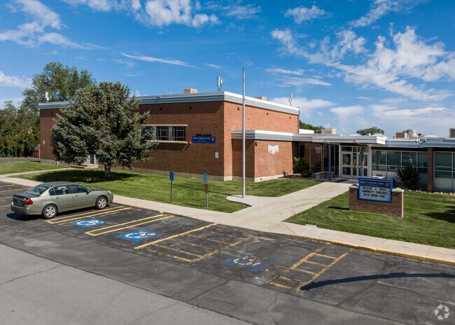 The entrance at Grant Elementary has a vibrant green lawn.