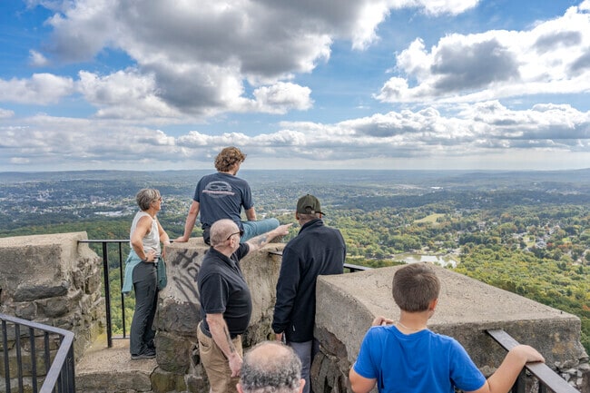 Enjoy panoramic vistas from the stonework observation deck at Hubbard Park in Meriden.