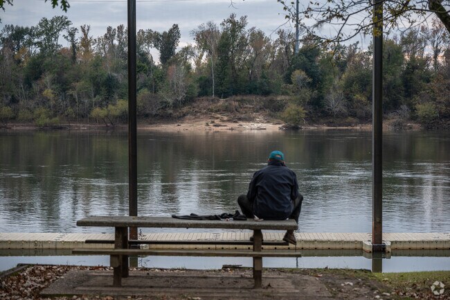 Picnic tables offer calming views in River Landing Park.