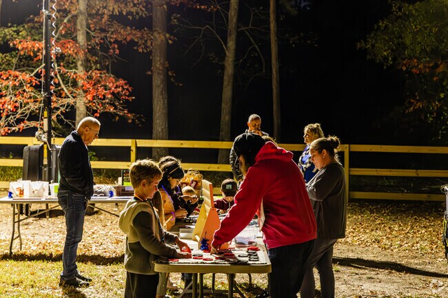Family and friends are playing games together at the Cultural Arts Center.