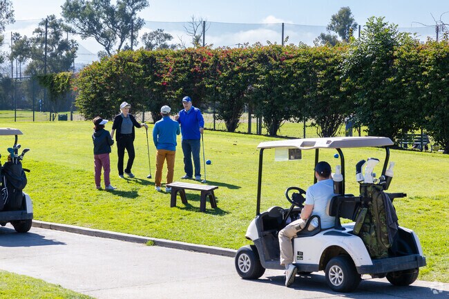 Del Aire residents practice their swing at Chester Washington Golf Course.