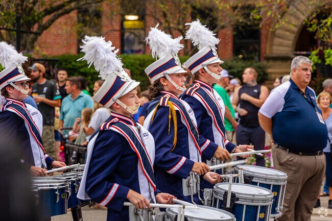 Koke Mill residents can support the school marching band at the Twilight Parade.