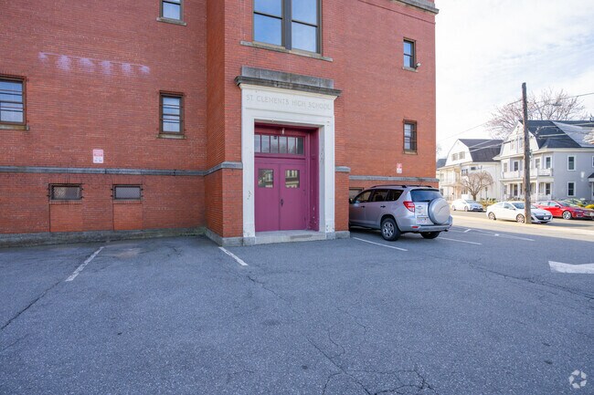 There's a small parking lot behind the St Clement Elementary School building in Somerville.