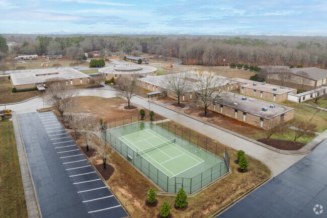 Woodruff Elementary School features a well-maintained tennis court for students to use.