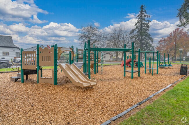 Modern playgrounds at Rivenes Park in Hubbard, OR.