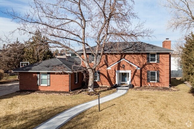 A brick colonial inspired home in Columbine Valley, Colorado.