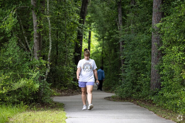 Residents of Harper's Landing enjoy the shaded trail along Blair Bridge Drive.