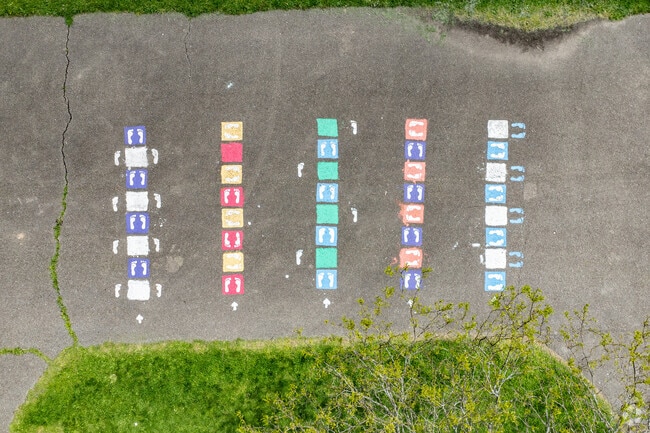 Kids enjoy sidewalk games at Phillip Murray Park.