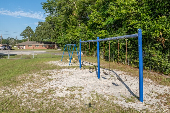 Students swing during recess at United Christian Academy.