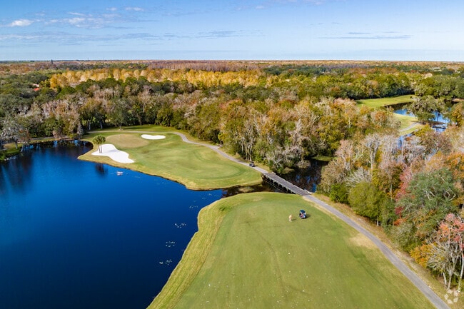 Tampa Palms Country Club Golf Course with water view.
