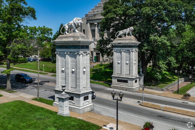 University City has a very grand entrance with lion statues sitting on top in University City.