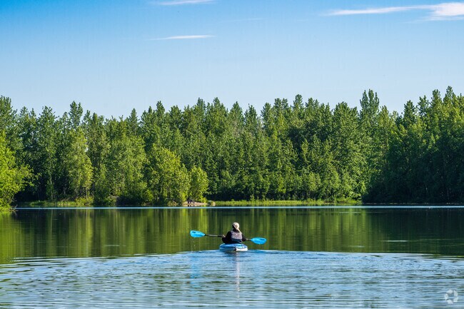 Kayakers enjoy a beautiful day at Cheney Lake Park.