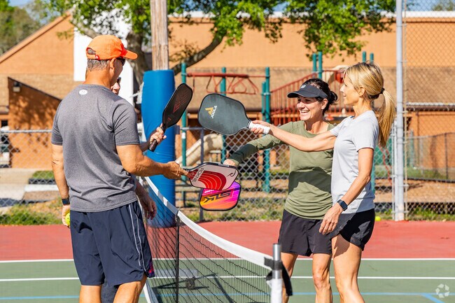 Residents and members enjoy the new pickleball courts in Long Lake Ranch, FL.