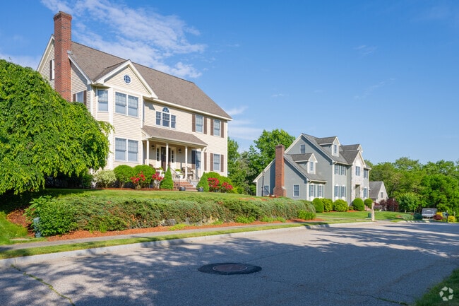 Certain streets within Woburn Country Club have larger New Traditional-style homes.