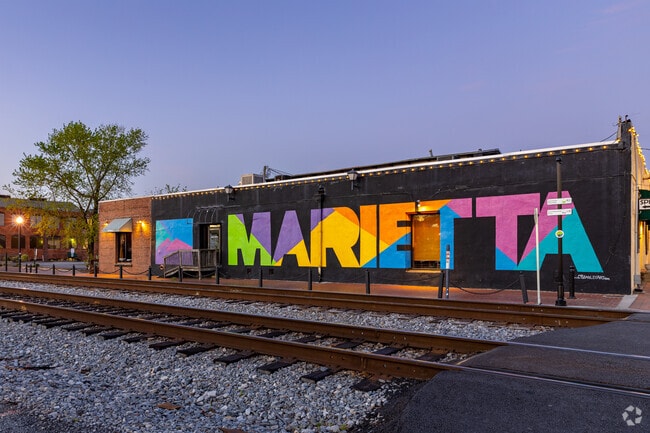 You'll find a colorful Downtown Marietta, GA mural by the downtown train tracks.