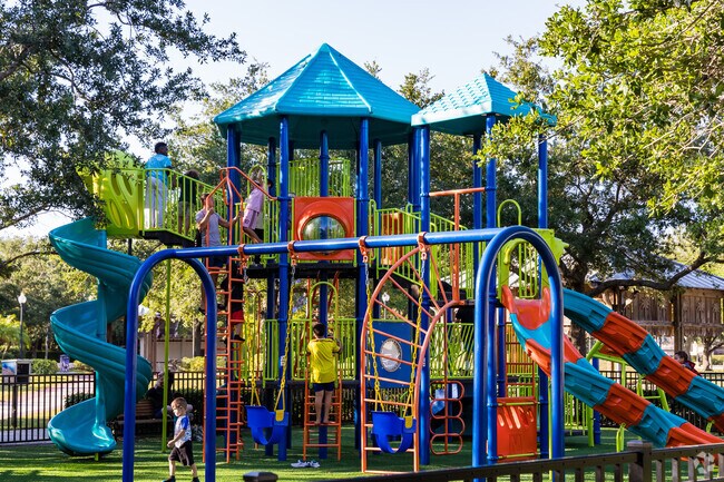 Village Walk children having a great time on the playground in Veterans Park.