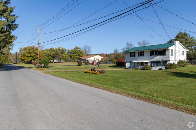 Some homes in the Woodward neighborhood have lawns that are well cared for.