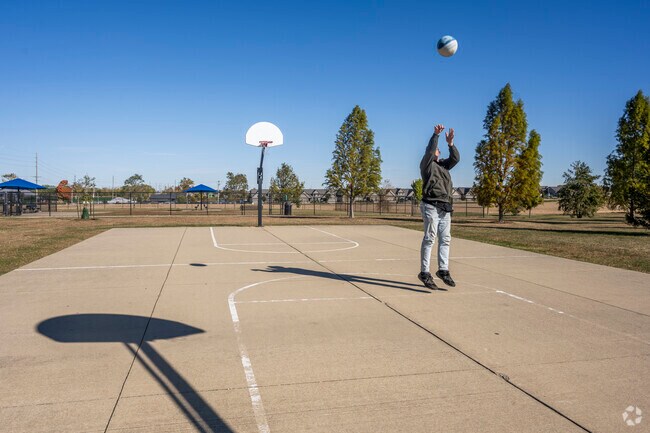 Go for a three pointer on the basketball courts at Shepard Dog Park in nearby Normal.