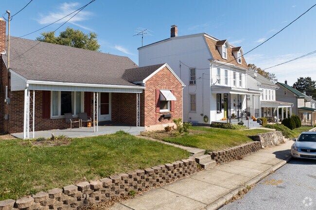 Multiple styles line the streets with a sidewalk for neighbors to say hello with.