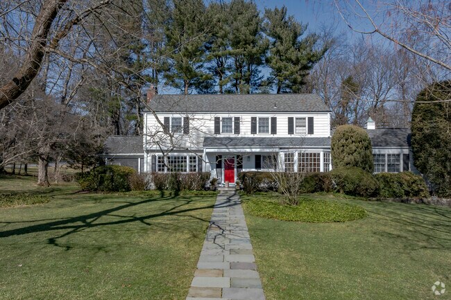 The bright red door on this larger home on West Pl in Chappaqua really makes it stand out.