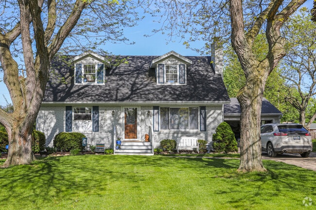 Well-kept Cape Cod homes sit on lush green lots in Delta Township.