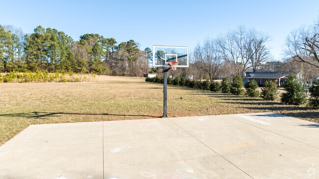 Kids enjoy the basketball court on campus when they break from the classroom.