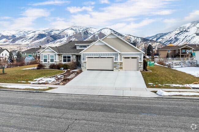 Craftsman style homes with nice yards line quiet streets in North Logan.
