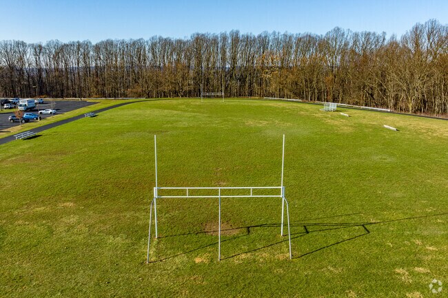 A large open field with field goalposts is located at Wendover Middle School.