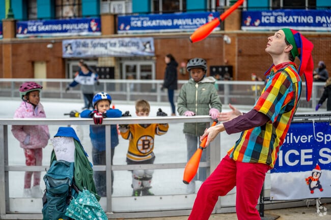 A juggler entertains little ice skaters at the Veterans Plaza Ice Rink in Silver Spring.