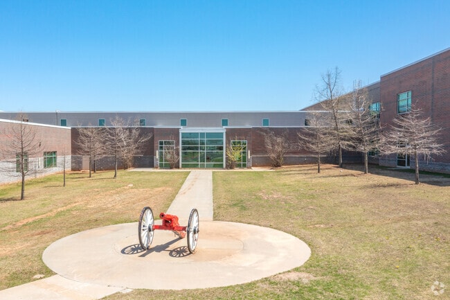 U.S. Grant High School with cannon in Highlander Community South.
