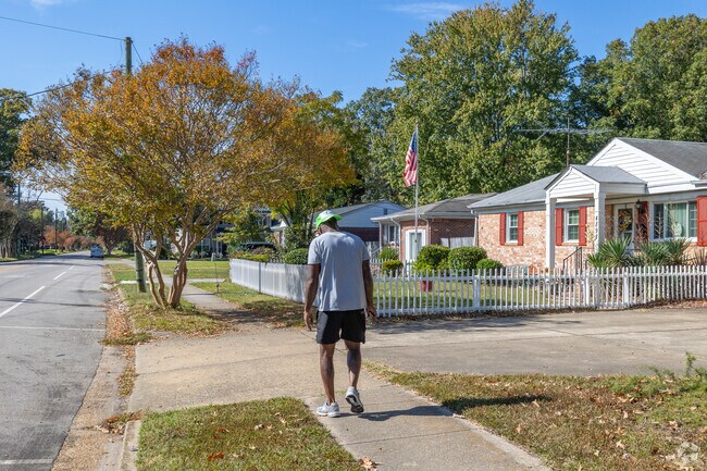 The Elmhurst neighborhood features well-maintained sidewalks ideal for an afternoon stroll.