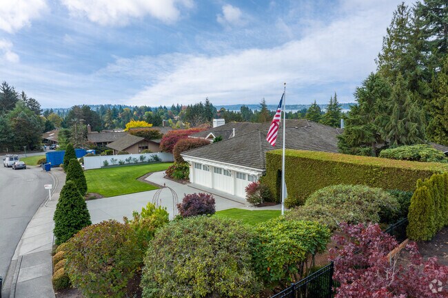 Clyde Hill mid-century modern houses feature mature landscaping.