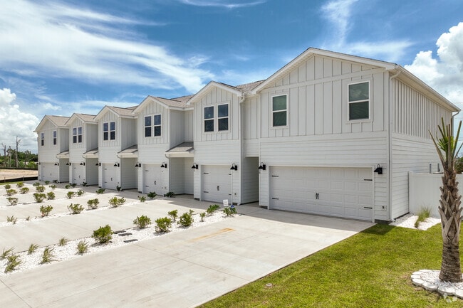 New build townhomes with modern coastal features are being built across the street from beach access in St. Joe Beach.