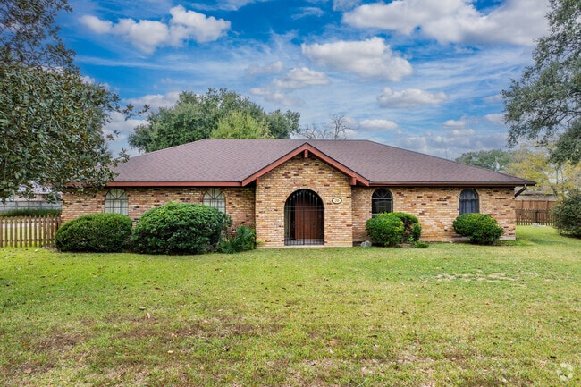 A single story ranch style home sits among an ample sized lot in Broussard, LA.