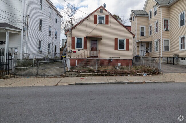 Historic worker's cottage in Lawrence, showcasing simple design and timeless character.