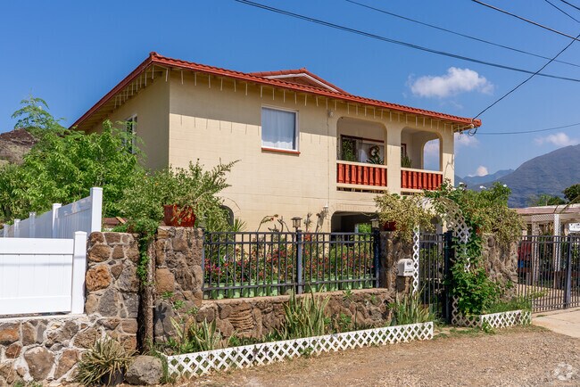 Spanish style homes with tile roofing help to dispel the heat on hot days in Nanakuli.
