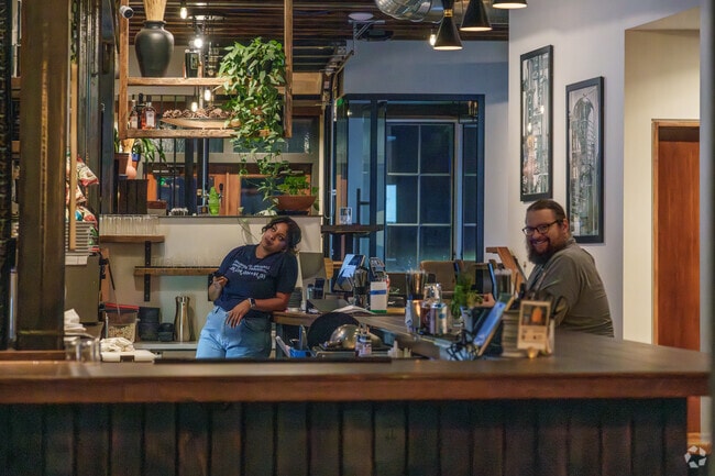 A local resident enjoys a twilight cocktail in Sewickley near Ben Avon Heights.