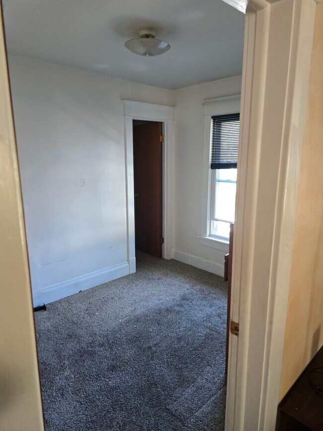 Rear bedroom and closet large window