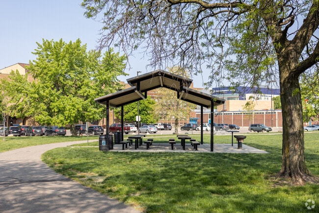 Covered picnic benches and BBQ area in Midtown's Tolan Park provide a nice place for a picnic.